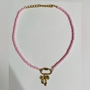 Pink Beaded Necklace with Gold Bow Charm